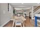 Open dining room with hardwood floors flowing into the living room and stairwell at 521 Andes Ln, Canton, GA 30114