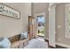 Inviting foyer with wood floors, bench seating, and a view through the front door to a beautifully landscaped yard at 521 Andes Ln, Canton, GA 30114