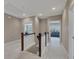 Upstairs hallway featuring neutral paint, white carpet and access to bedrooms at 521 Andes Ln, Canton, GA 30114