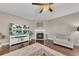 Bright living room featuring a fireplace, hardwood floors and comfortable seating at 521 Andes Ln, Canton, GA 30114
