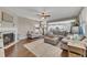 Cozy living room with fireplace, plush seating, and view to kitchen at 521 Andes Ln, Canton, GA 30114