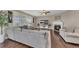 Open living room featuring a fireplace, plantation shutters and hardwood floors at 521 Andes Ln, Canton, GA 30114