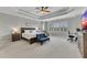 Spacious main bedroom features a trey ceiling, large windows, and a cozy seating area at 521 Andes Ln, Canton, GA 30114
