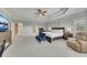 Bright main bedroom boasts a trey ceiling and carpet, along with ample space for furnishings at 521 Andes Ln, Canton, GA 30114