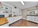 Spacious pantry with white shelving and cabinets, butcher block countertops and wood flooring at 521 Andes Ln, Canton, GA 30114
