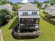 Aerial view of the home's rear exterior, featuring a spacious backyard and well-maintained landscaping at 521 Andes Ln, Canton, GA 30114