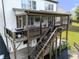 Inviting screened porch with outdoor dining area and grill, perfect for entertaining and enjoying the backyard view at 521 Andes Ln, Canton, GA 30114