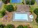 Aerial view showcasing a large community pool, lounge chairs, umbrellas, and a playground in a well-maintained area at 521 Andes Ln, Canton, GA 30114