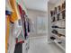 Organized walk-in closet with shelves, hanging rods, and ample storage space for clothing and accessories at 521 Andes Ln, Canton, GA 30114