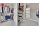 Well-organized walk-in closet featuring shelving and hanging space for maximum storage and convenience at 521 Andes Ln, Canton, GA 30114