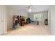Large bonus room with several arcade games and a ceiling fan at 801 Windsor Rdg, Canton, GA 30115