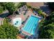 Aerial view of community pool with ample lounge seating and umbrellas at 801 Windsor Rdg, Canton, GA 30115