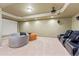 Entertainment room with projector, screen, and comfortable seating at 801 Windsor Rdg, Canton, GA 30115