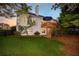 Exterior elevation featuring a multi-story home with a deck and landscaped backyard at 801 Windsor Rdg, Canton, GA 30115