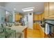 Well-lit kitchen featuring wooden cabinets, stainless steel appliances, and a breakfast bar with seating at 801 Windsor Rdg, Canton, GA 30115