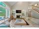 Spacious living room with a stone fireplace, vaulted ceilings, and large windows at 801 Windsor Rdg, Canton, GA 30115