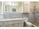 Neutral bathroom featuring a granite vanity, ceramic tile backsplash, toilet, and walk-in shower at 1646 Rainier Falls Ne Dr, Atlanta, GA 30329