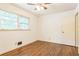 Cozy bedroom featuring hardwood floors, fresh paint, and a window with a view at 1646 Rainier Falls Ne Dr, Atlanta, GA 30329