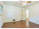 Bedroom with hardwood floors, bright light, and a ceiling fan at 1646 Rainier Falls Ne Dr, Atlanta, GA 30329