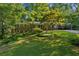 Charming single Gathering home with brick accents, a well-manicured lawn, and mature landscaping at 1646 Rainier Falls Ne Dr, Atlanta, GA 30329