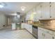 Beautiful kitchen with stainless steel appliances, granite countertops, tile floors and ample cabinet space at 1646 Rainier Falls Ne Dr, Atlanta, GA 30329