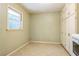Tiled laundry room featuring ample storage and a functional design at 1646 Rainier Falls Ne Dr, Atlanta, GA 30329