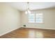 Bright living room with hardwood floors and a modern light fixture at 1646 Rainier Falls Ne Dr, Atlanta, GA 30329