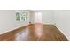 Bright and spacious living room featuring hardwood floors, fresh paint, and natural light at 1646 Rainier Falls Ne Dr, Atlanta, GA 30329