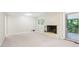 Inviting living room with a fireplace, white brick, neutral carpet and access to a screened-in porch at 1646 Rainier Falls Ne Dr, Atlanta, GA 30329