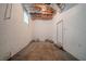 Unfinished basement space featuring concrete floor, brick walls, and a single window at 1658 Pine Glen Cir, Decatur, GA 30035