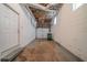 Unfinished basement with cement floor, brick walls, and a door to the outside at 1658 Pine Glen Cir, Decatur, GA 30035