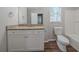 Well-lit bathroom featuring granite countertops and modern fixtures at 1658 Pine Glen Cir, Decatur, GA 30035