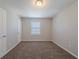 Well-lit bedroom featuring wall-to-wall carpet and natural light at 1658 Pine Glen Cir, Decatur, GA 30035