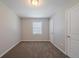 Light-filled bedroom with window and carpeted floors at 1658 Pine Glen Cir, Decatur, GA 30035