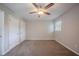 Empty bedroom featuring wall-to-wall carpet and natural light at 1658 Pine Glen Cir, Decatur, GA 30035