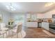 Eat-in kitchen with stainless appliances, granite counters, white cabinets, and a sliding door to the deck at 1658 Pine Glen Cir, Decatur, GA 30035