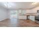 Kitchen with stainless appliances, granite counters, white cabinets, and a sliding door to the deck at 1658 Pine Glen Cir, Decatur, GA 30035