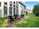 Backyard features outdoor seating on a brick patio and views of the home's architecture at 1691 Holcomb Lake Rd, Marietta, GA 30062