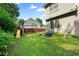 The backyard with playset and green lawn perfect for outdoor activities and relaxation at 1691 Holcomb Lake Rd, Marietta, GA 30062