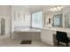 Bright bathroom with a large tub and vanity area, offering a relaxing retreat at 1691 Holcomb Lake Rd, Marietta, GA 30062
