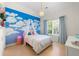 Charming bedroom with mural, soft lighting, and a whimsical decorative theme at 1691 Holcomb Lake Rd, Marietta, GA 30062