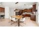 Spacious kitchen area featuring a center island, stainless appliances, dark wood cabinetry at 1691 Holcomb Lake Rd, Marietta, GA 30062
