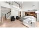 Open floor plan living room with staircase and view to the kitchen at 1691 Holcomb Lake Rd, Marietta, GA 30062