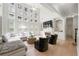 Bright living room featuring a wall of windows, fireplace, and light wood floors at 1691 Holcomb Lake Rd, Marietta, GA 30062