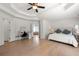 Spacious primary bedroom suite with a vanity area, neutral color scheme, and tray ceilings at 1691 Holcomb Lake Rd, Marietta, GA 30062