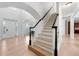 Elegant staircase with black handrail and white spindles at 1691 Holcomb Lake Rd, Marietta, GA 30062
