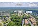 Aerial view of the home and community in Lawrenceville, GA, near the Yellow River and Ronald Reagan Park at 176 Oak Green Dr, Lawrenceville, GA 30044