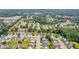 Aerial view of the residential community showcasing the neighborhood layout and surrounding trees at 176 Oak Green Dr, Lawrenceville, GA 30044