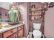 Half bathroom featuring a vessel sink and wooden cabinets for stylish storage at 176 Oak Green Dr, Lawrenceville, GA 30044