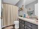 Bathroom with gray walls, granite sink top, and patterned shower curtain at 176 Oak Green Dr, Lawrenceville, GA 30044